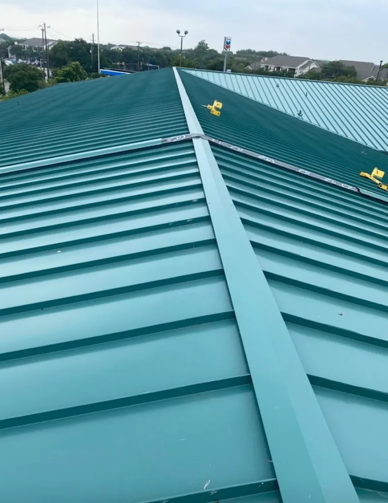 Green commercial metal roof ridge and valley for Metal Roof Repair in St. John