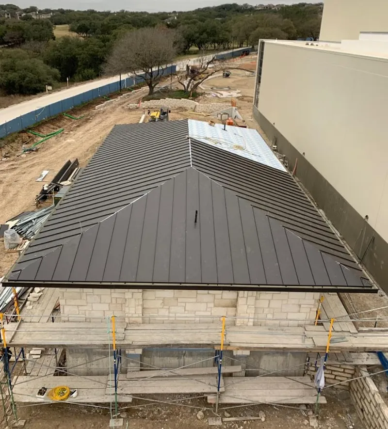 Metal roof new construction with scaffolding in St. John